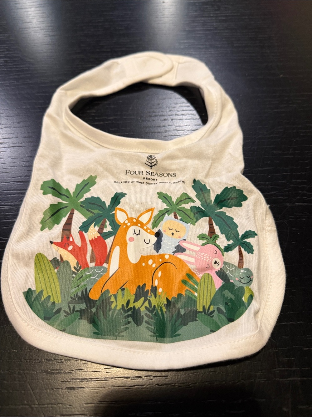 Four Seasons Orlando Cream Baby Bib with Colorful Forest Animal Print